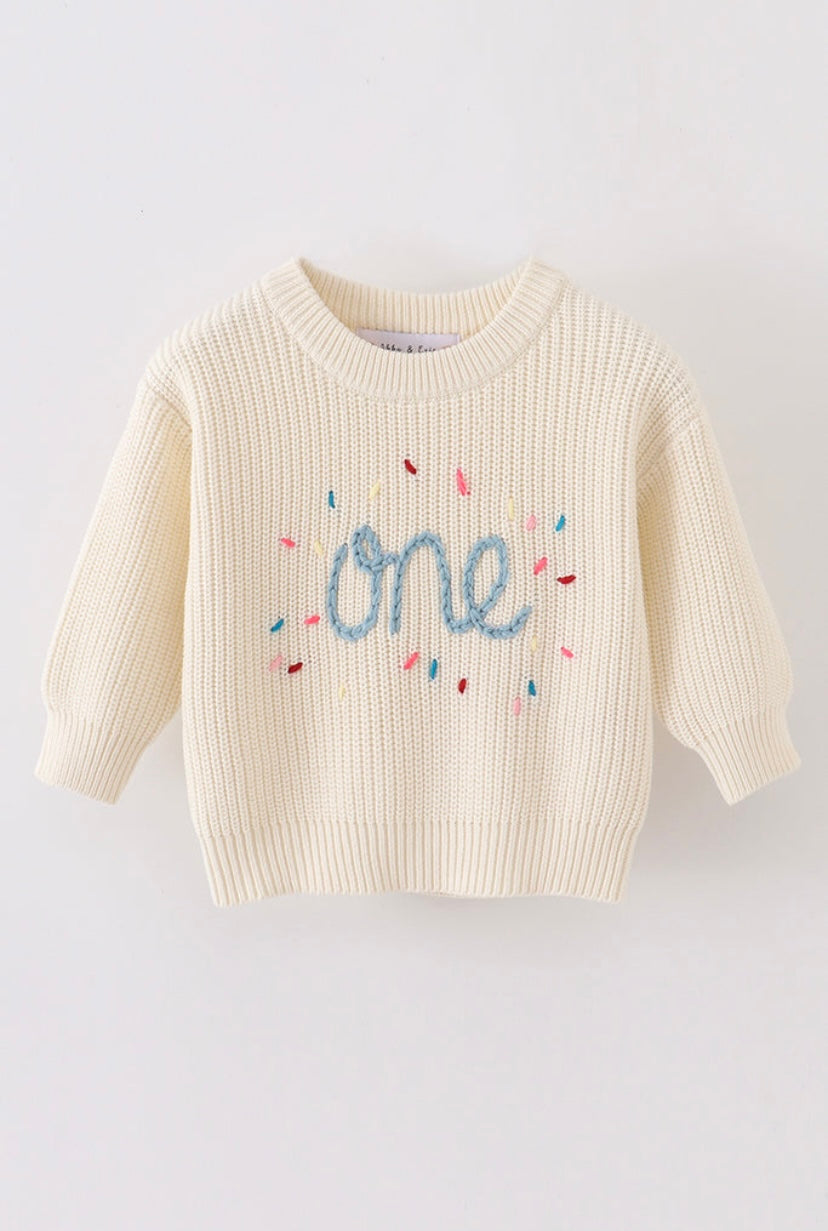 Hand-embroidered “One” sweater