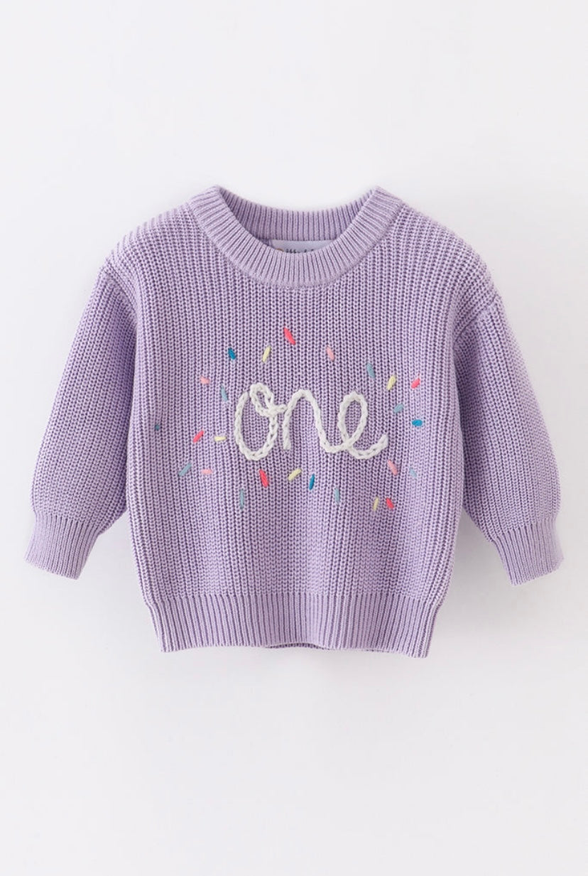 Hand-embroidered “One” sweater
